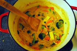 Cooking the vegetables, curry, and coconut milk