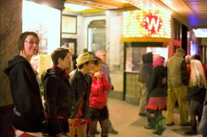 A crowd gathers outside the Wilma Theater