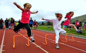 The girls' hurdles race at the Missoula Youth Track Meet.