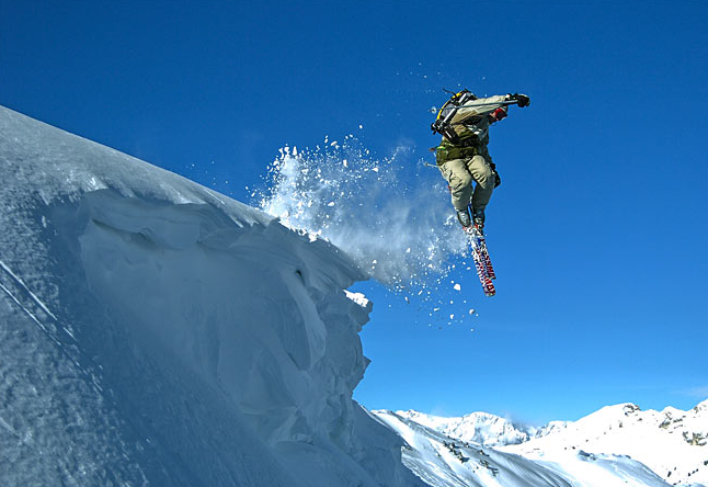 A skier shows a cornice who's boss.