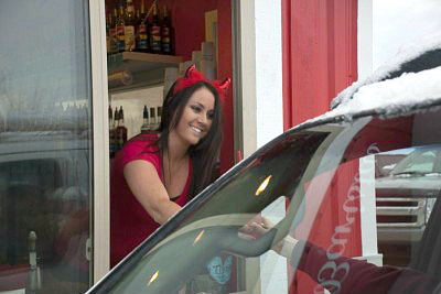 Barista Marteen says the skimpy outfits are worth it when you can earn $100 a day in tips for serving coffee.